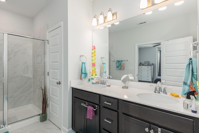 bathroom with vanity and walk in shower