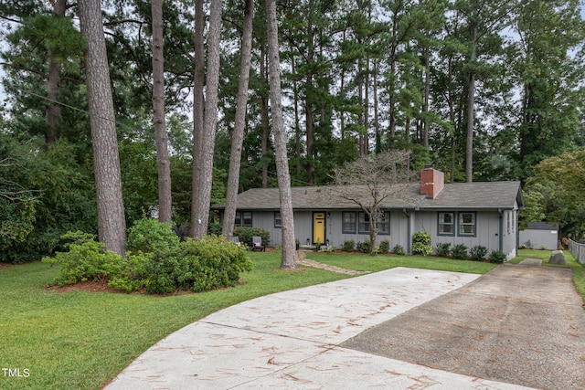 ranch-style home with a front lawn