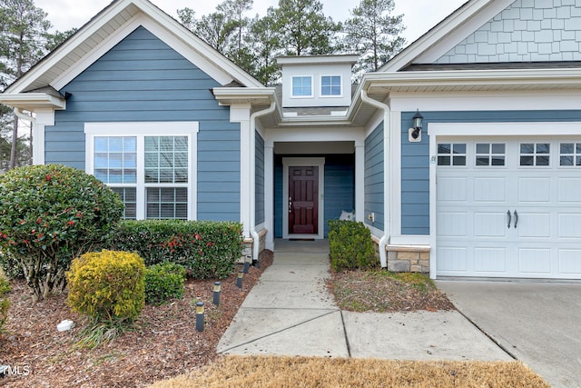 doorway to property featuring a garage