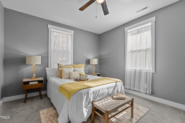 carpeted bedroom with ceiling fan