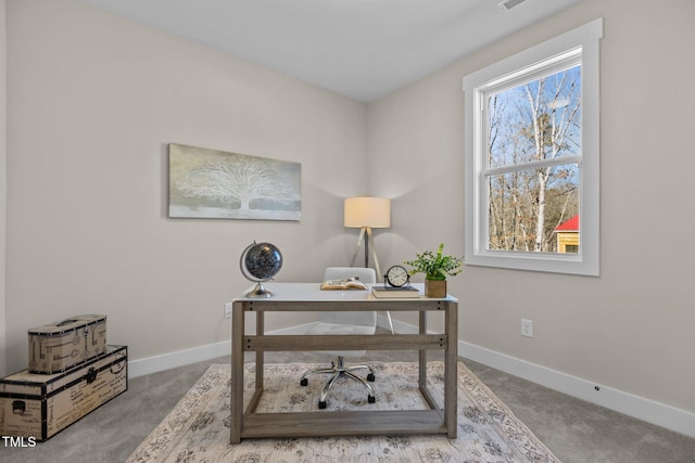 office with carpet flooring and a wealth of natural light