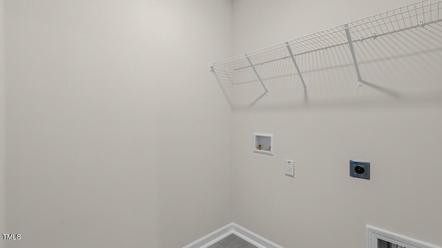 clothes washing area with washer hookup, laundry area, baseboards, and electric dryer hookup