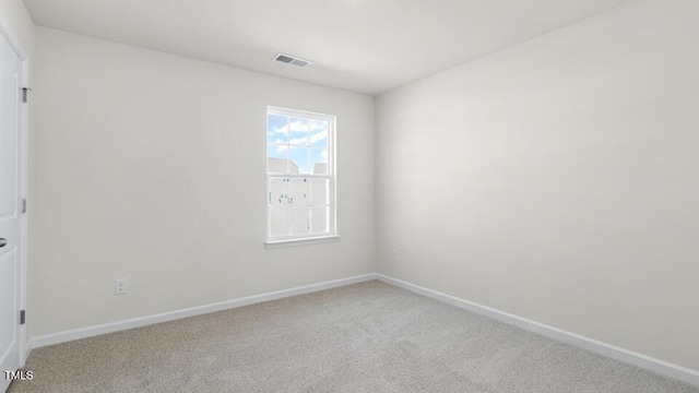 unfurnished room featuring carpet flooring, baseboards, and visible vents