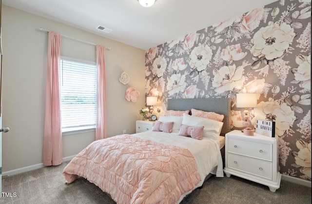 carpeted bedroom featuring multiple windows