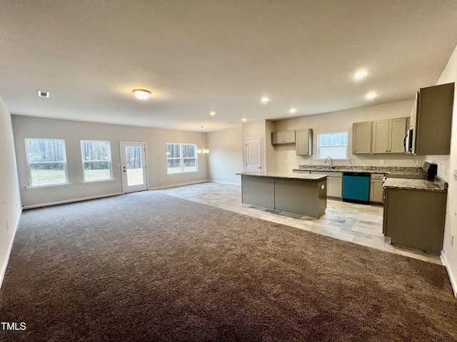 kitchen featuring visible vents, open floor plan, light colored carpet, dishwasher, and gray cabinets