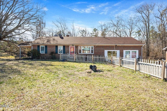 ranch-style home featuring a front yard