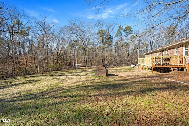 view of yard featuring a wooden deck