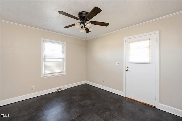 empty room featuring ceiling fan and crown molding