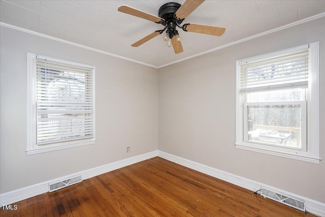 unfurnished room featuring wood-type flooring, a wealth of natural light, ornamental molding, and ceiling fan