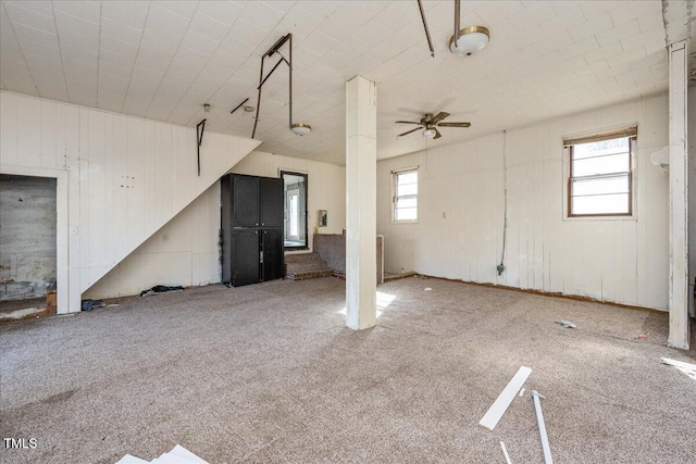 interior space featuring ceiling fan