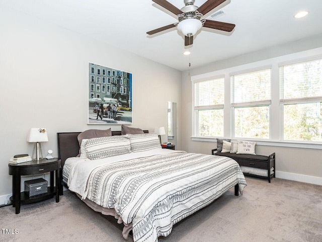 carpeted bedroom featuring ceiling fan