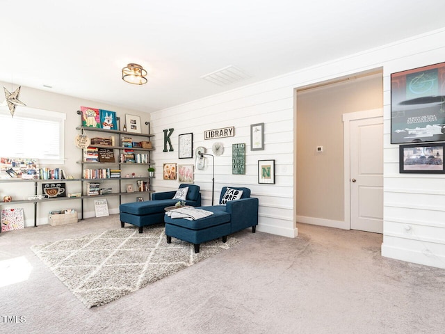 living area featuring carpet floors