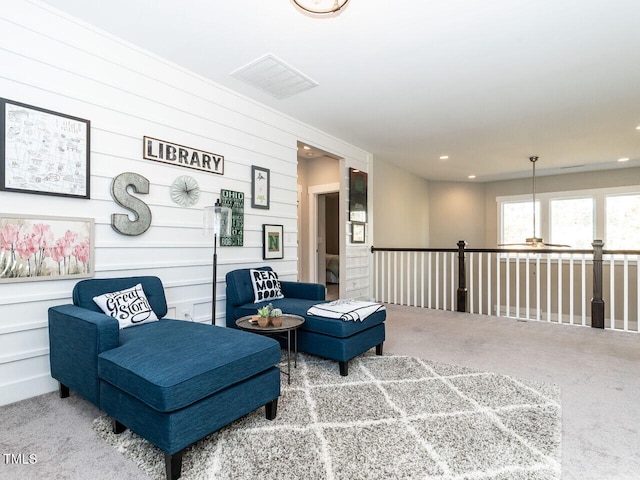 sitting room featuring carpet