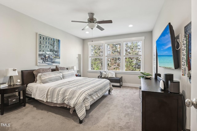 bedroom featuring ceiling fan and carpet