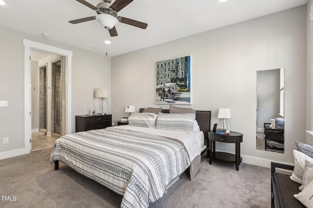 carpeted bedroom featuring ceiling fan and ensuite bath