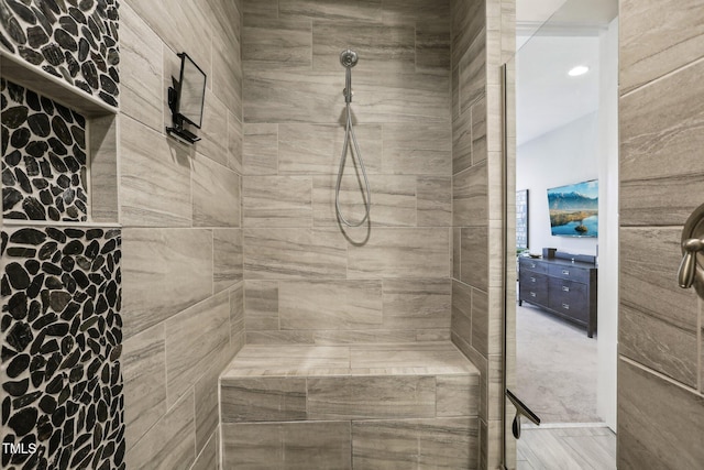 bathroom with tiled shower