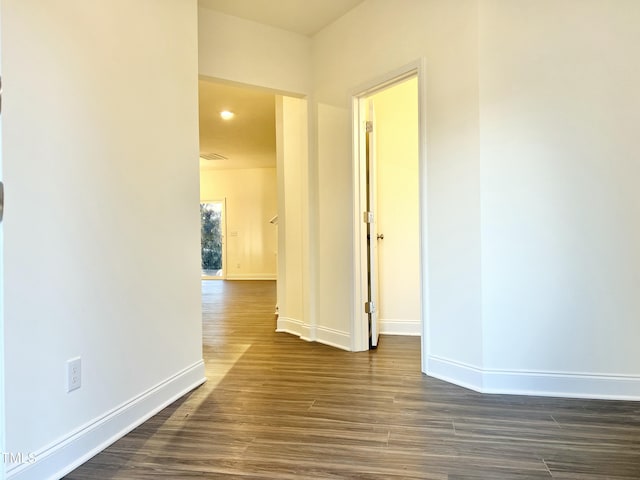 hall with dark hardwood / wood-style flooring