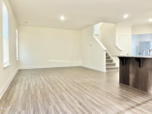 unfurnished living room with light hardwood / wood-style floors