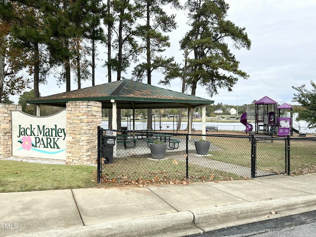 surrounding community with a yard and a playground