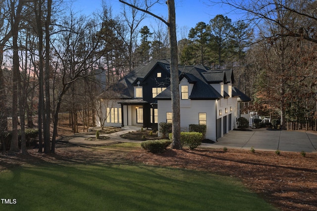 view of front facade with a front lawn and a garage