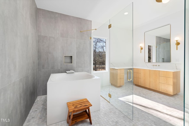 bathroom featuring tile patterned floors, vanity, and an enclosed shower