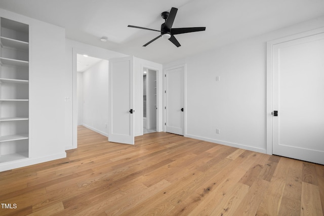 empty room featuring ceiling fan and light hardwood / wood-style floors