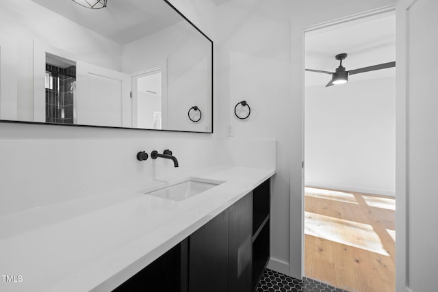 bathroom featuring ceiling fan and vanity