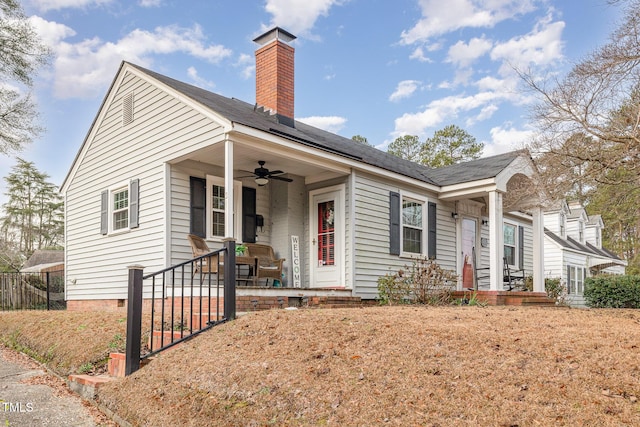 view of front of house featuring ceiling fan and a porch