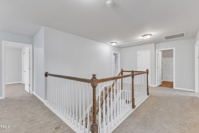 corridor with light colored carpet