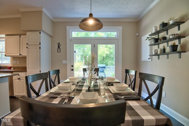 dining space with baseboards, ornamental molding, dark wood-style flooring, and a textured ceiling