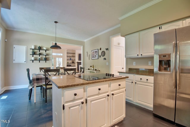 kitchen with black electric cooktop, dark tile patterned flooring, white cabinetry, stainless steel refrigerator with ice dispenser, and crown molding