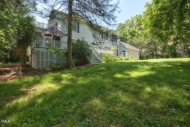 view of yard with stairway and a wooden deck