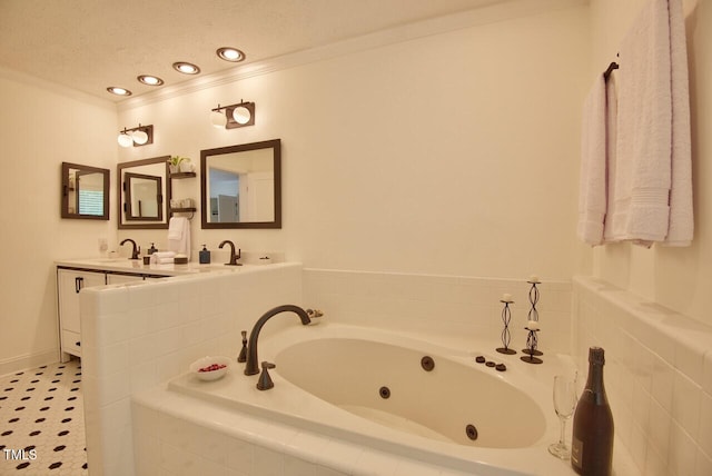 full bath with crown molding, a sink, double vanity, recessed lighting, and a tub with jets