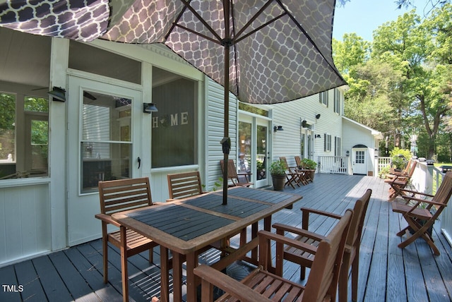 wooden deck with outdoor dining space