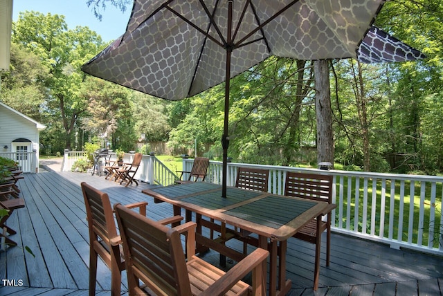 wooden deck with outdoor dining space