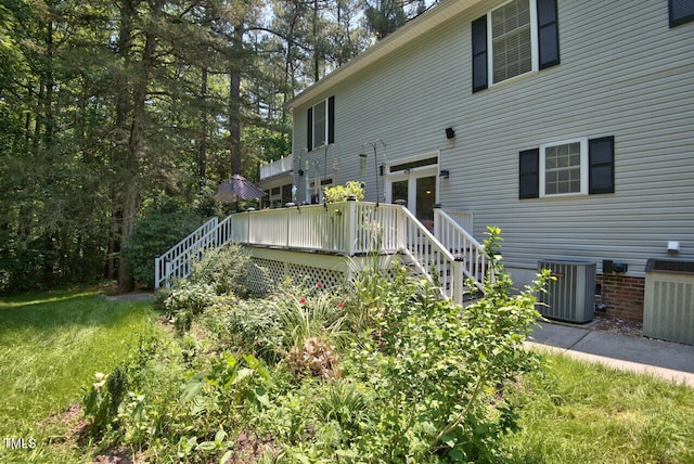 340 Andrews Store Rd, Pittsboro, NC 27312 - back of property featuring cooling unit, stairway, and a deck