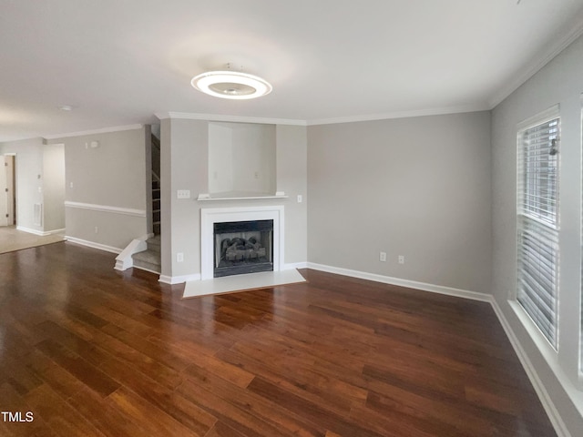 unfurnished living room with ornamental molding and dark wood-type flooring