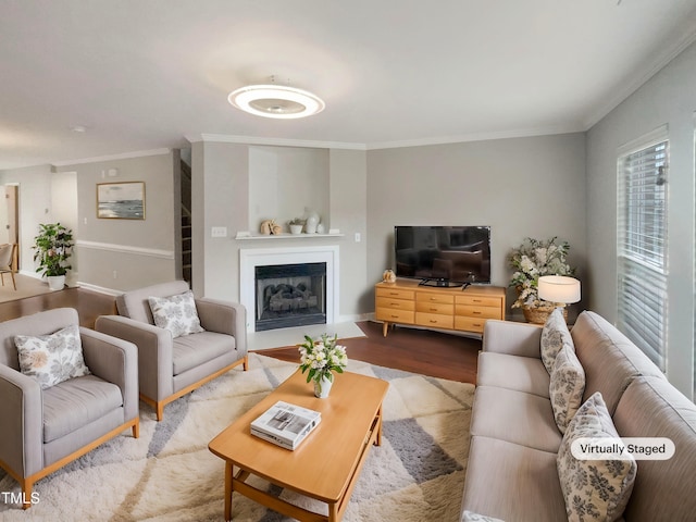 living room featuring crown molding and light hardwood / wood-style flooring