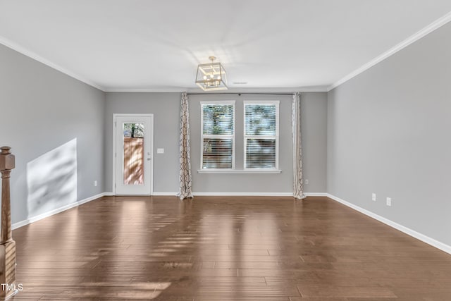 unfurnished living room featuring dark hardwood / wood-style flooring and ornamental molding