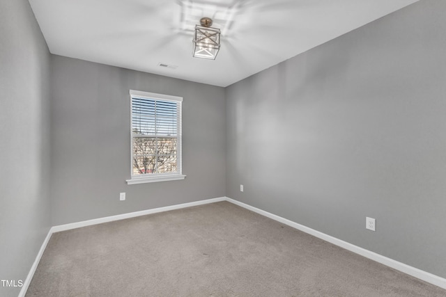 unfurnished room featuring carpet floors