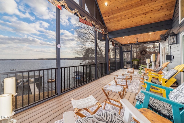 wooden deck featuring a water view