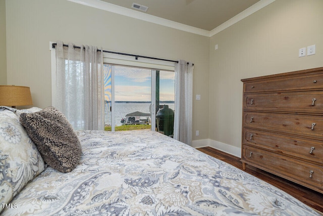 bedroom with hardwood / wood-style floors, access to exterior, crown molding, and a water view