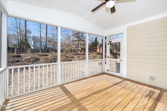 unfurnished sunroom with a ceiling fan and lofted ceiling