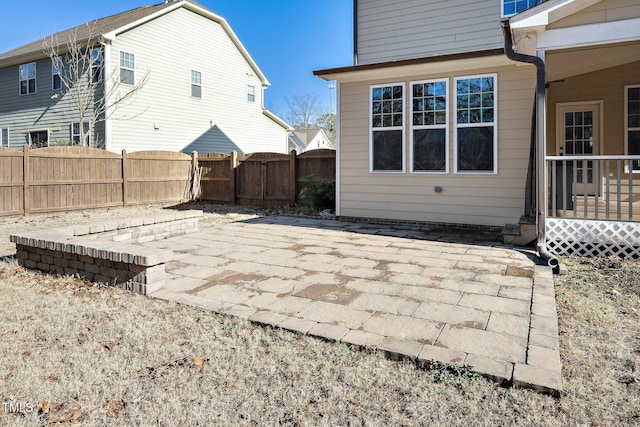 back of property with a patio and fence