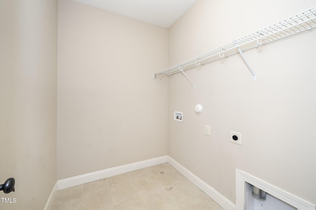 laundry area with hookup for a washing machine, hookup for a gas dryer, laundry area, baseboards, and electric dryer hookup