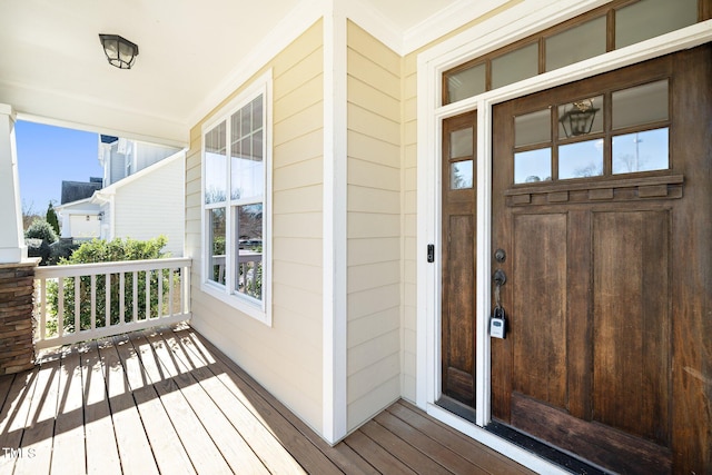 entrance to property featuring covered porch