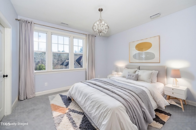 bedroom with baseboards, visible vents, a chandelier, and light colored carpet