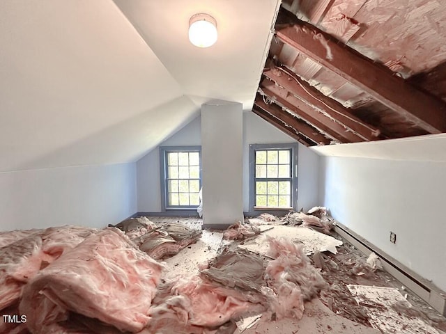 bedroom with baseboard heating and vaulted ceiling