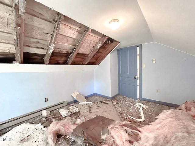 bonus room with lofted ceiling and a baseboard heating unit