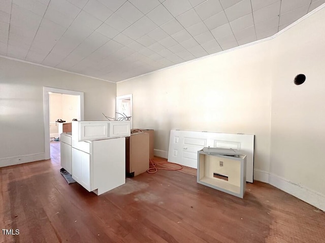 washroom with dark hardwood / wood-style flooring and ornamental molding